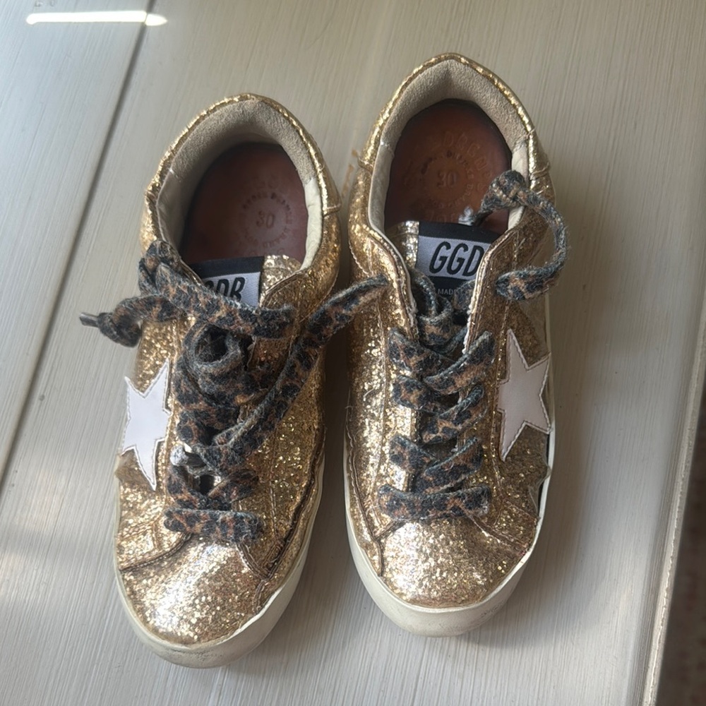 Golden Goose Gold and White Sneakers with Distressed Look